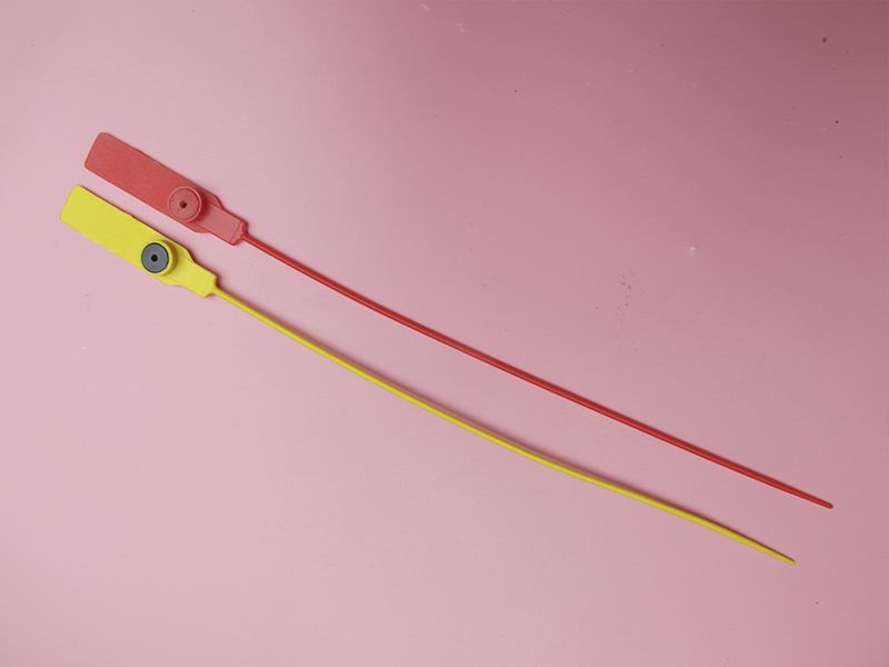Plastic seal with metal insert lock